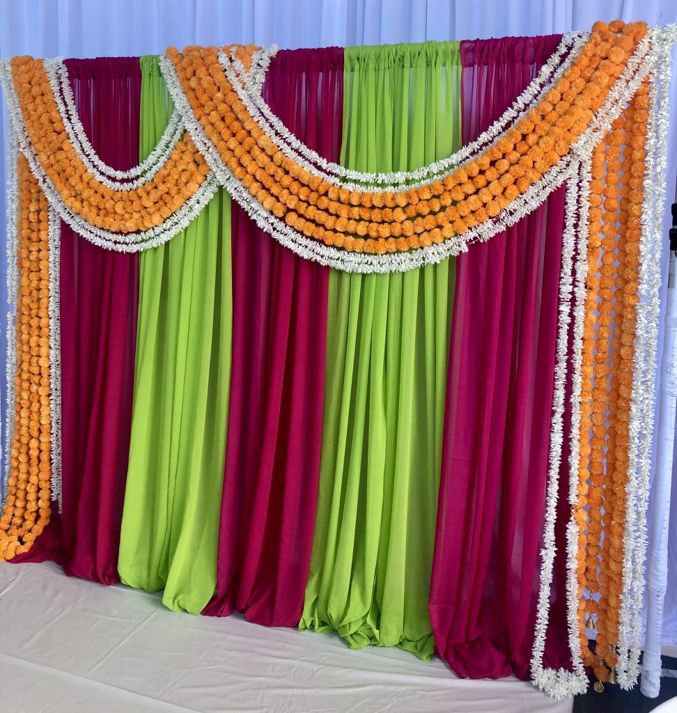 Colourful Backdrop with marigold toran