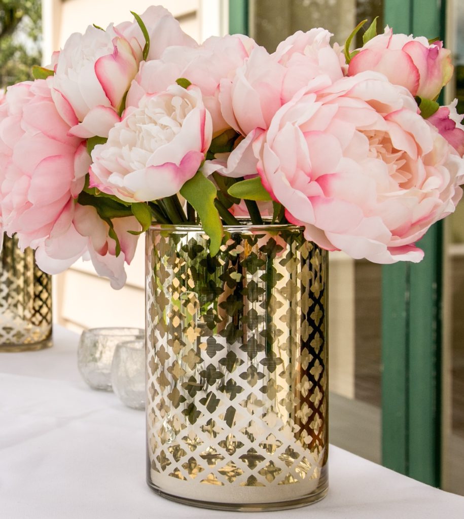 Gold vase with peach flowers